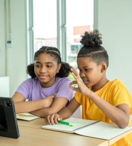 Elementary school children using digital tablet in classroom,Education,Wireless technology and school concept.